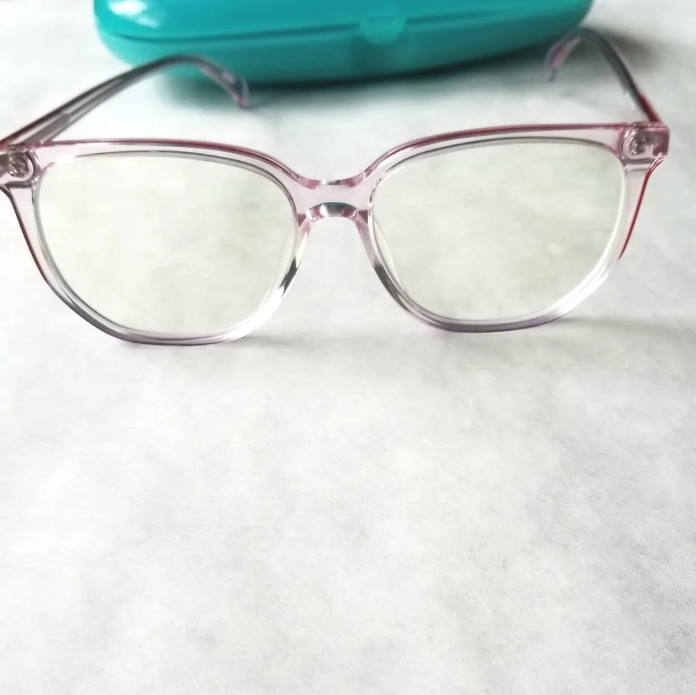 Zenni clear glass frames with red accent on top of frames with hard blue…